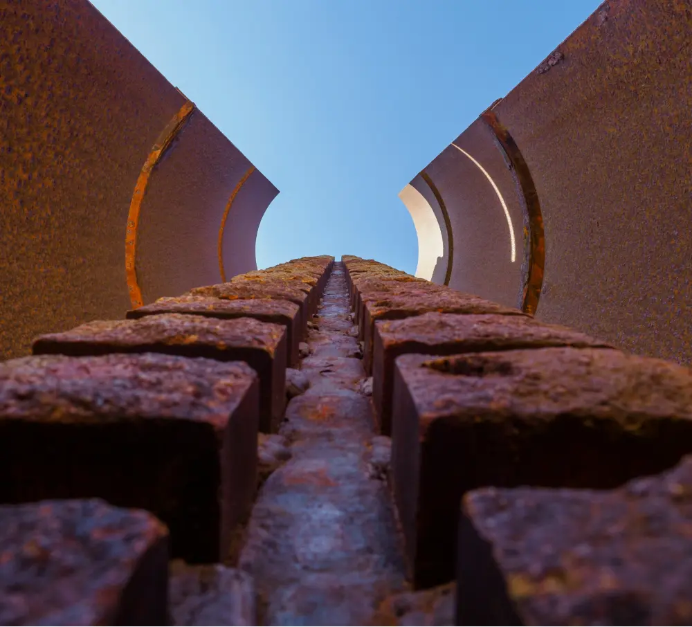 A new methodology to detect corrosion on steel truss railway bridges exploiting local strain gauges: Analytical, numerical, and experimental validation